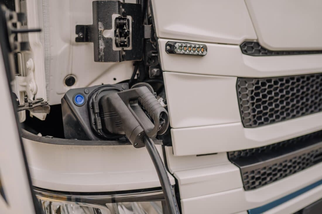 Electric,Truck,Batteries,Are,Charged,From,The,Charging,Station.,Concept