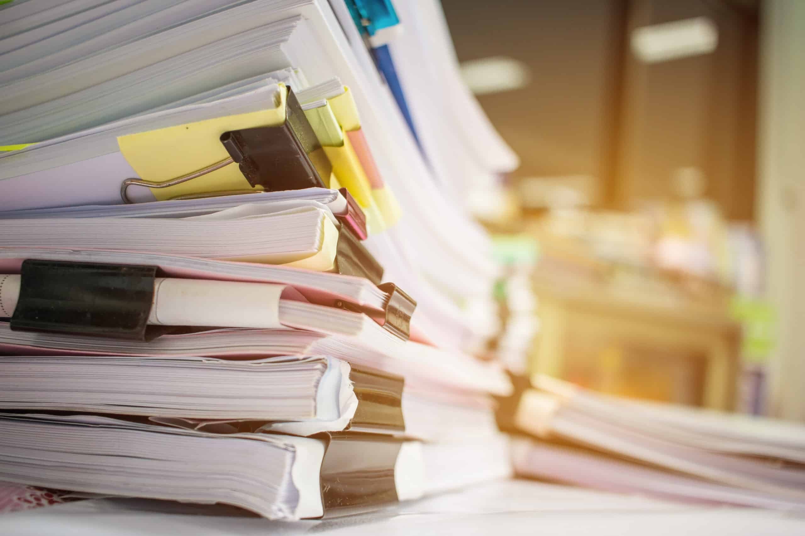 Paper,Stack,,Pile,Of,Unfinished,Documents,On,Office,Desk,Related
